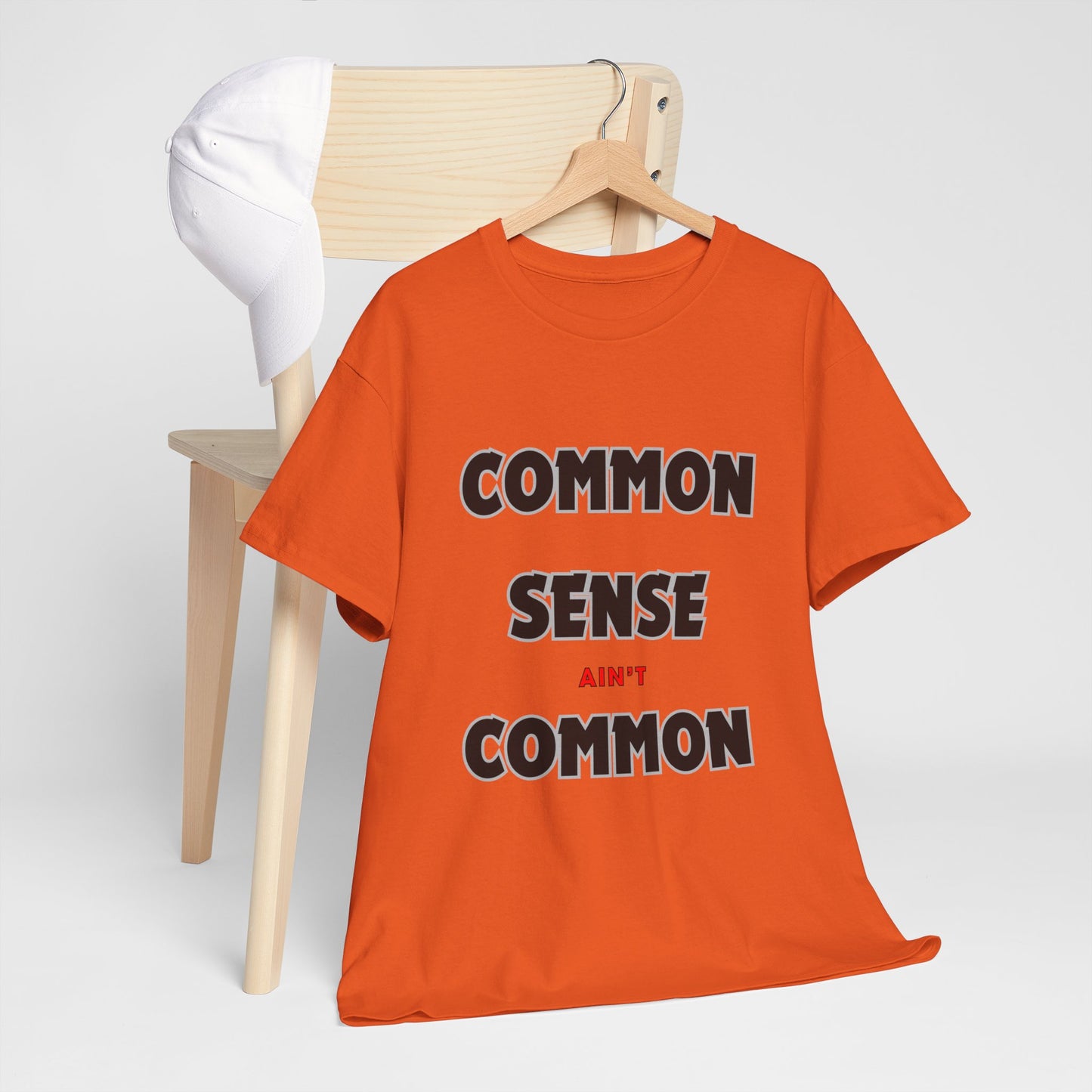 COMMON SENSE AIN'T COMMON - 2- Unisex Heavy Cotton Tee