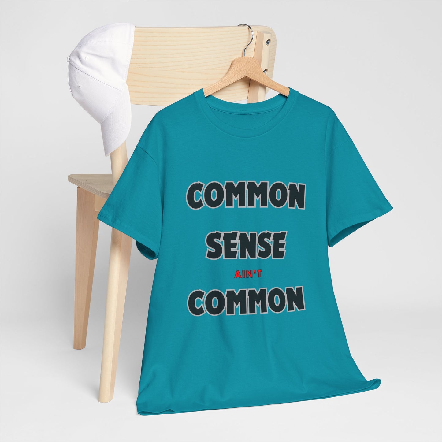 COMMON SENSE AIN'T COMMON - 2- Unisex Heavy Cotton Tee